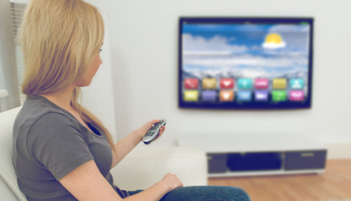 Woman In Front Of Television With Apps